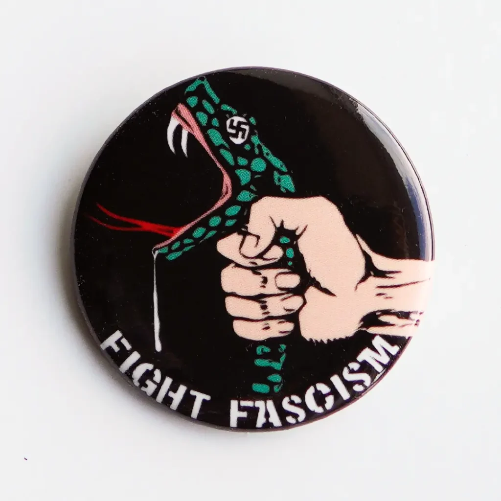 Close up of Fight Fascism button/pin